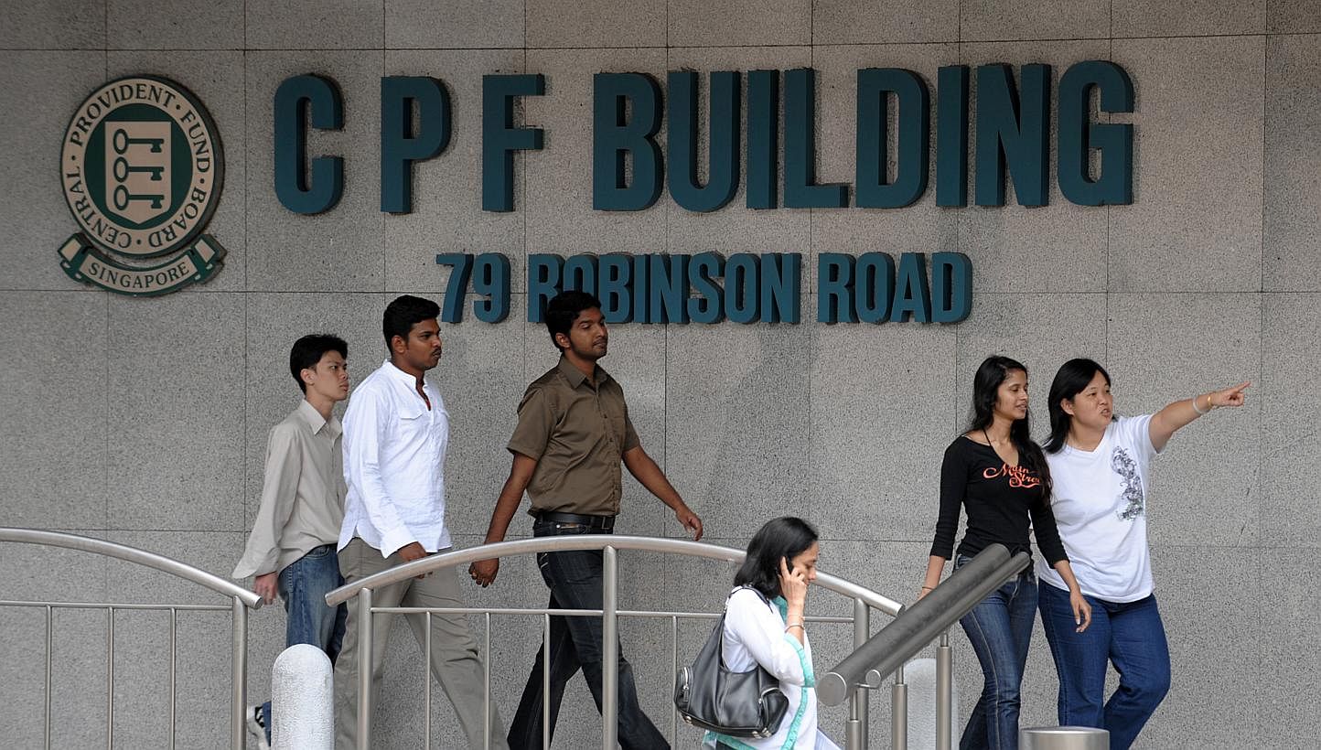 Workers outside CPF Building. CPF members will continue to get a 2.5 per cent interest rate on their on Ordinary Accounts (OA) from Oct 1 to Dec 31 this year. -- ST FILE PHOTO: CAROLINE CHIA