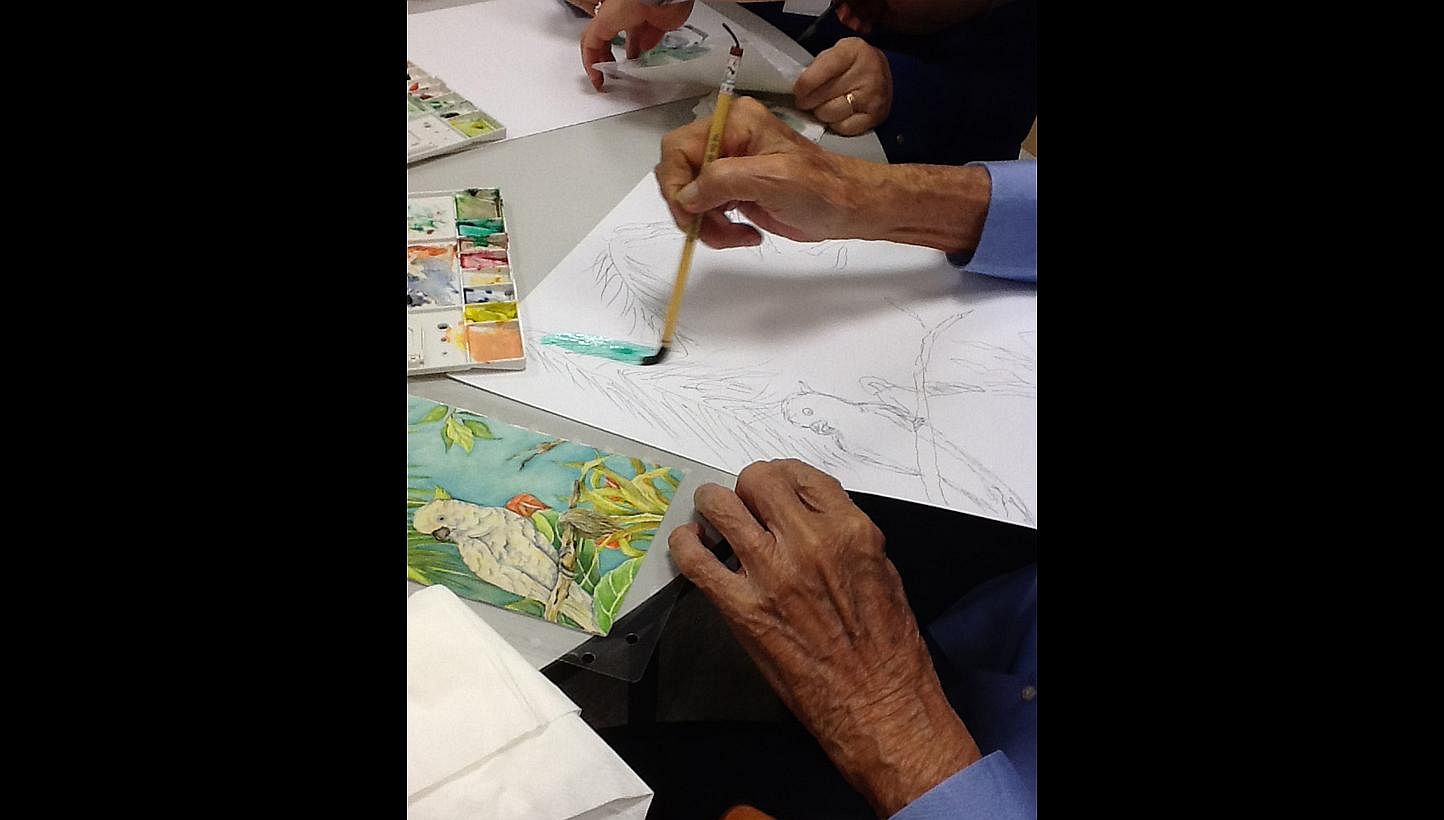 Patients painting during a MindVital session. The programme, which is suited for those with early signs of dementia, and whose sessions run for eight weeks, was spurred by feedback from families about  elderly patients being inactive at home.