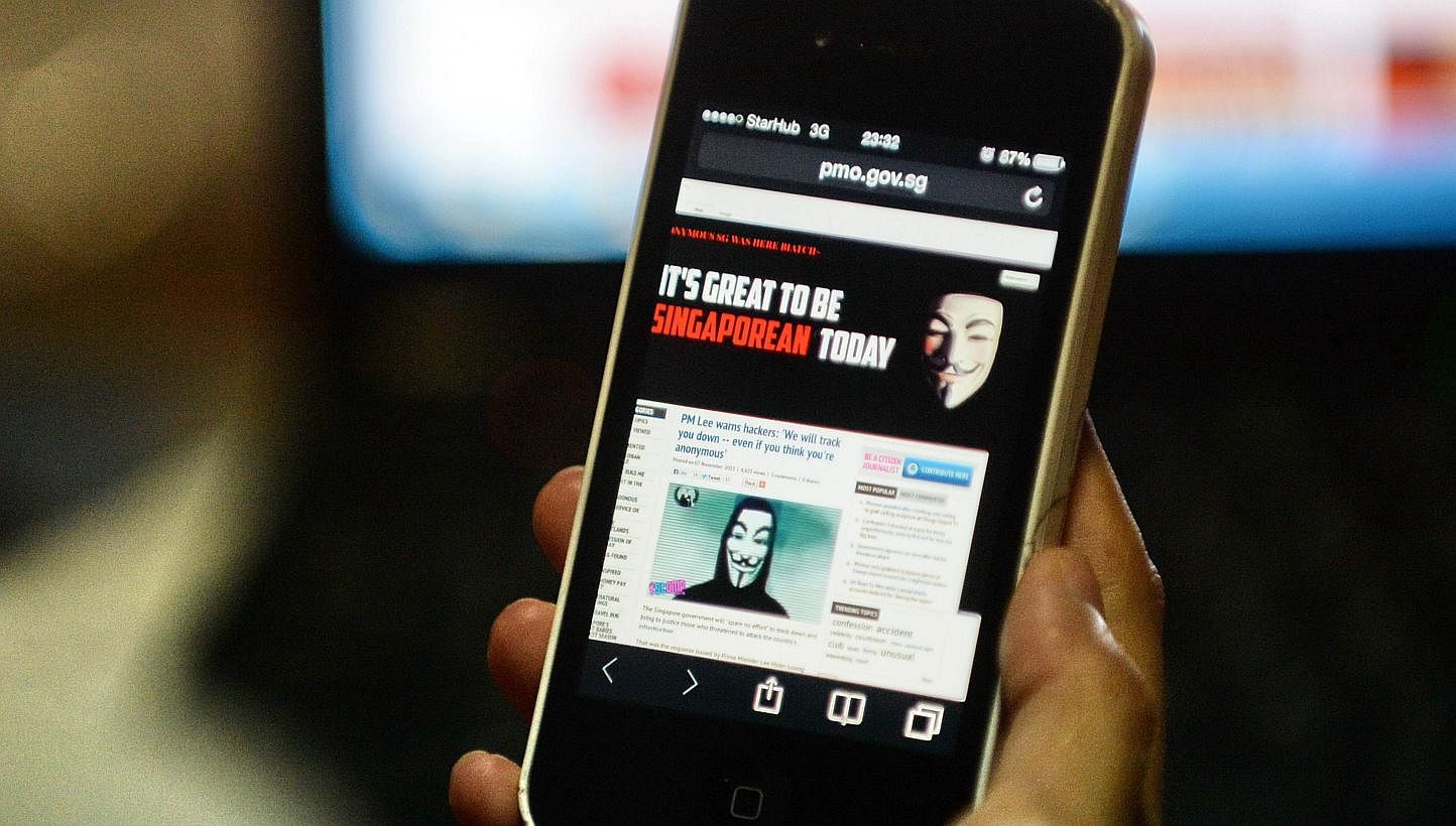 Activist hacker group Anonymous is seen through the internet government website of Singapore Prime Minister Office circulated online on a smartphone in Singapore on Thursday, Nov 7, 2013.&nbsp;An unusually high amount of traffic to many Government si