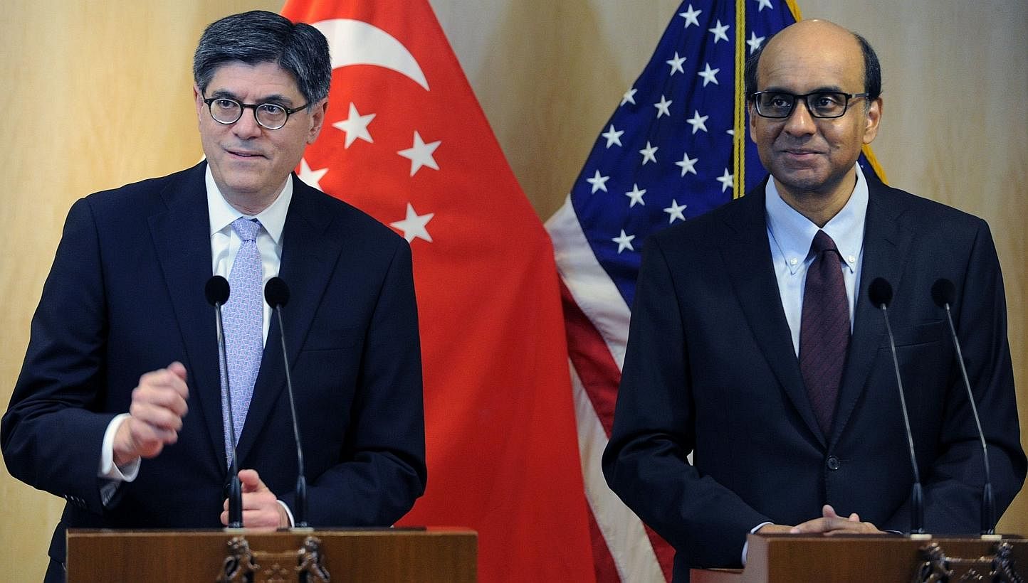 US Treasury Secretary Jack Lew (left) and Singapor&nbsp;Deputy Prime Minister and Finance Minister Tharman Shanmugaratnam&nbsp;attend a media briefing after their meeting in Singapore on Nov 13, 2013.&nbsp;Singapore and the United States are both com