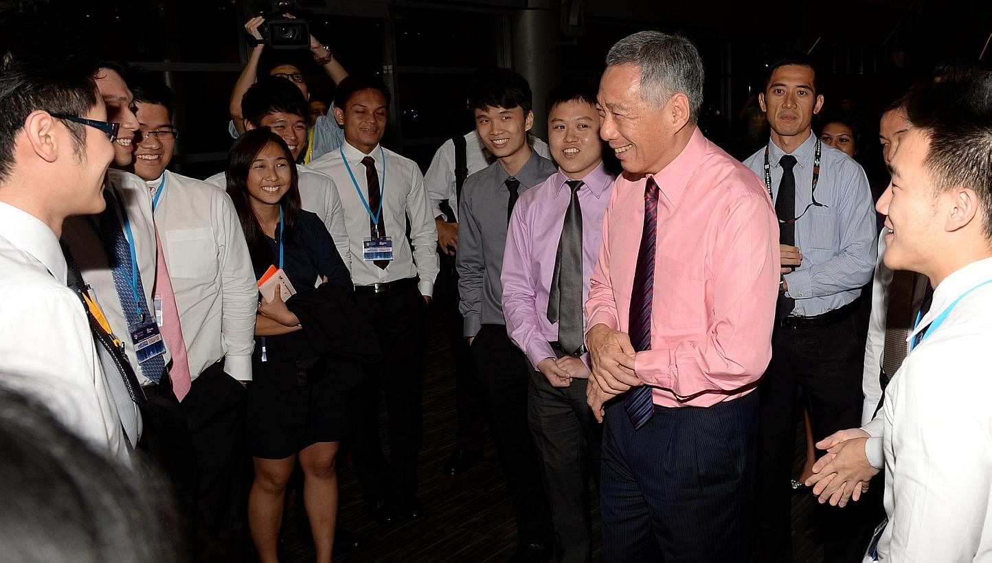 Mr Lee held a dialogue session with over 1,000 university students on Tuesday night on the topic of "Singapore - Progressing Together". -- ST PHOTO: AZIZ HUSSIN&nbsp;