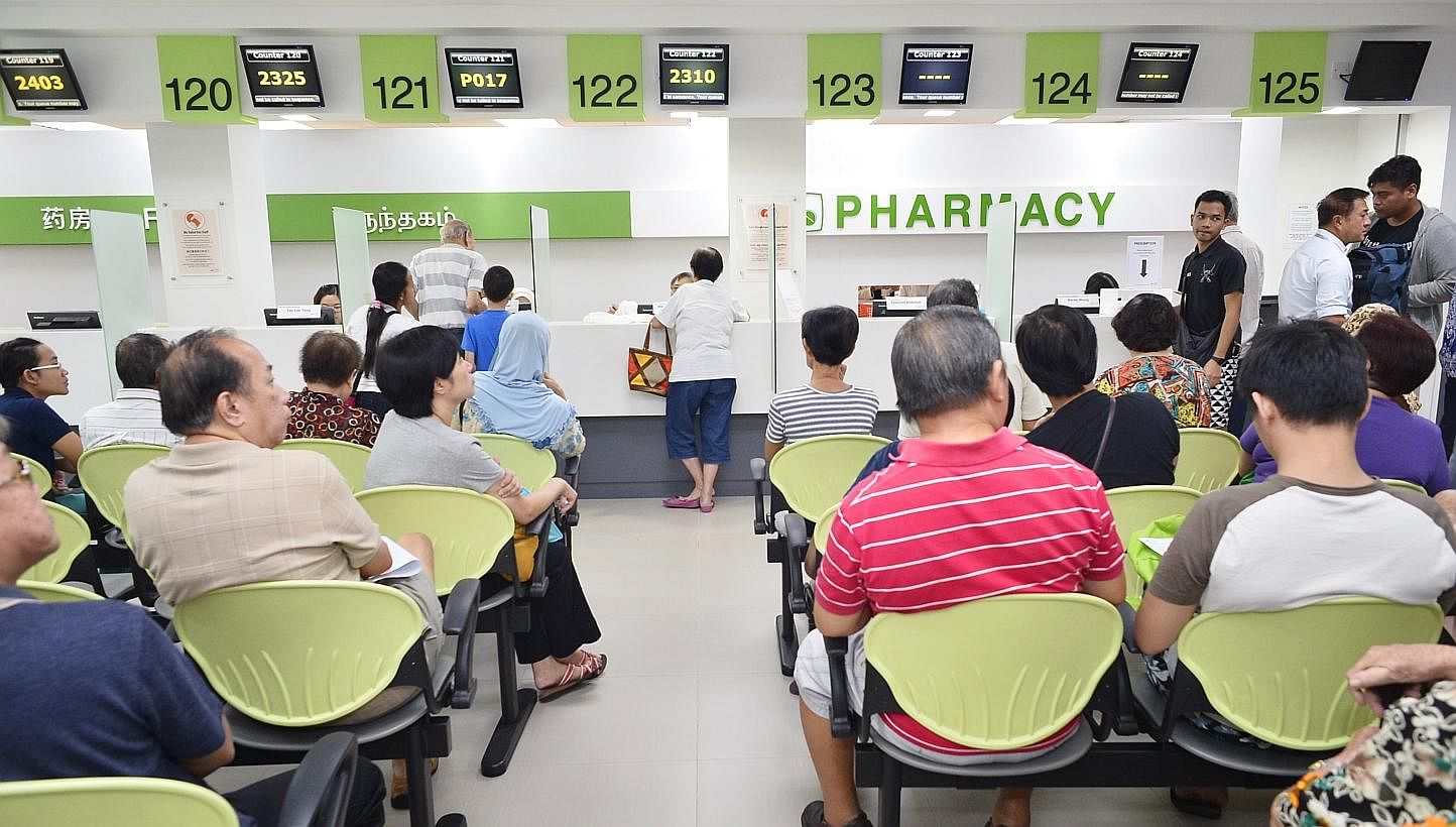 Patients waiting at the pharmacy of Tampines Polyclinic. Finance Minister Tharman Shanmugaratnam assured lower and middle-income groups on Friday that their Medishield premiums will remain affordable. -- ST FILE PHOTO: ASHLEIGH SIM