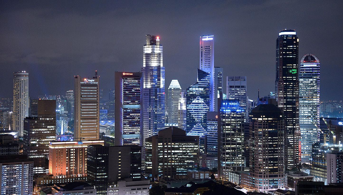 Private-sector economists have become slightly more cautious about Singapore's growth this year, according to the latest Monetary Authority of Singapore survey released on March 19, 2014. -- ST FILE PHOTO: LIM SIN THAI