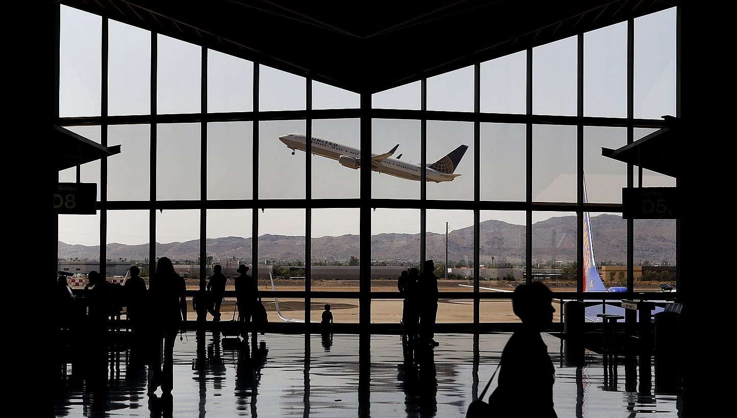 The fear of flying affects up to 30 per cent of people, but a severe phobia to the extent of avoiding air travel completely affects only 2 to 3 per cent of the population. -- PHOTO: BLOOMBERG