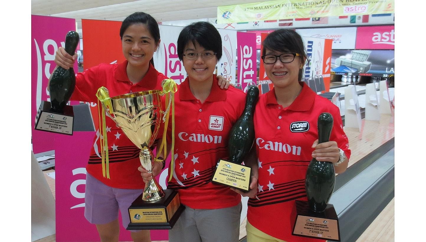 The Republic's keglers Daphne Tan, Cherie Tan and Joey Yeo (left to right) achieved an all-Singaporean podium sweep at the 37th Malaysian International Open. -- PHOTO: SINGAPORE BOWLING