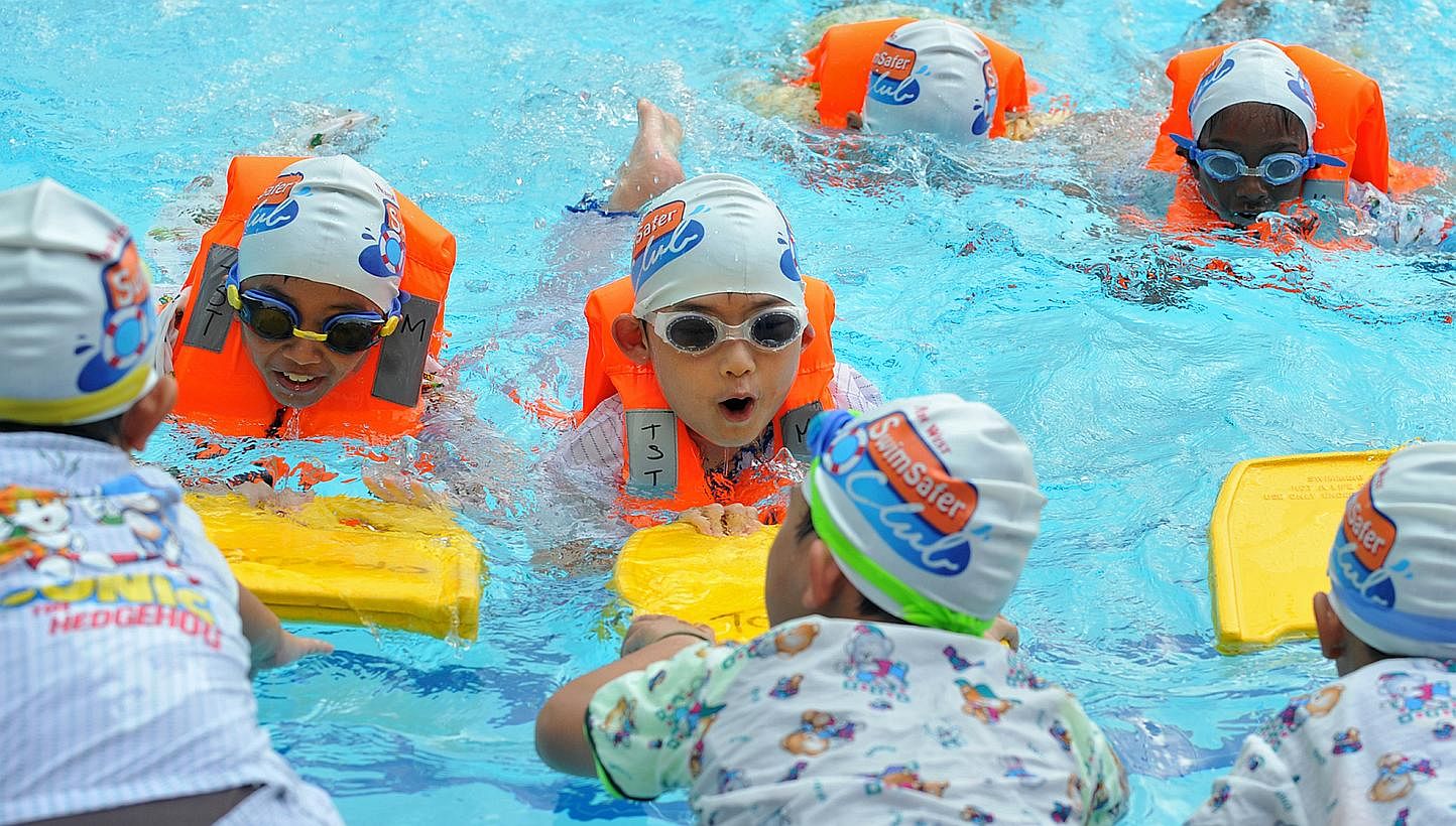 Children displaying water safety skills at the launch of the North West SwimSafer Clubs at Senja-Cashew Community Club in Bukit Panjang on Jan 29, 2011.&nbsp;In a first-ever deal between a corporation and a national water safety programme, national s
