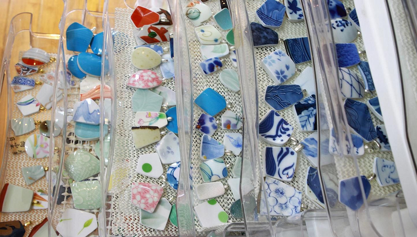 Pieces of broken pottery that were picked up by a team of volunteers. The pieces are washed and then cut down to size to be used to make jewellery.&nbsp;After the shards are polished, they are separated based on their shape, size and colour (above). 