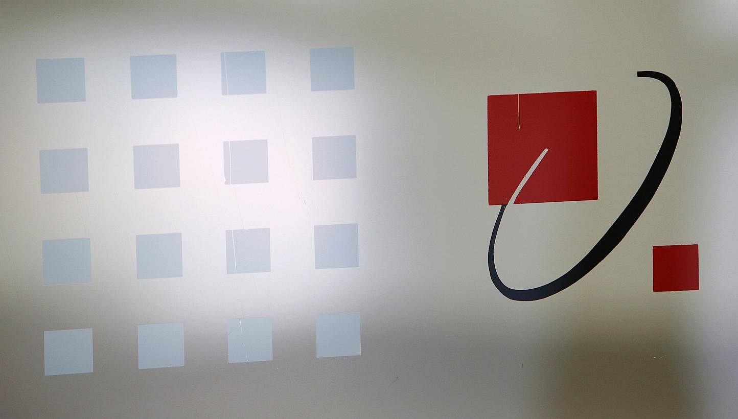 A SingTel signage is pictured at their head office in Singapore on May 15, 2014. -- PHOTO: REUTERS