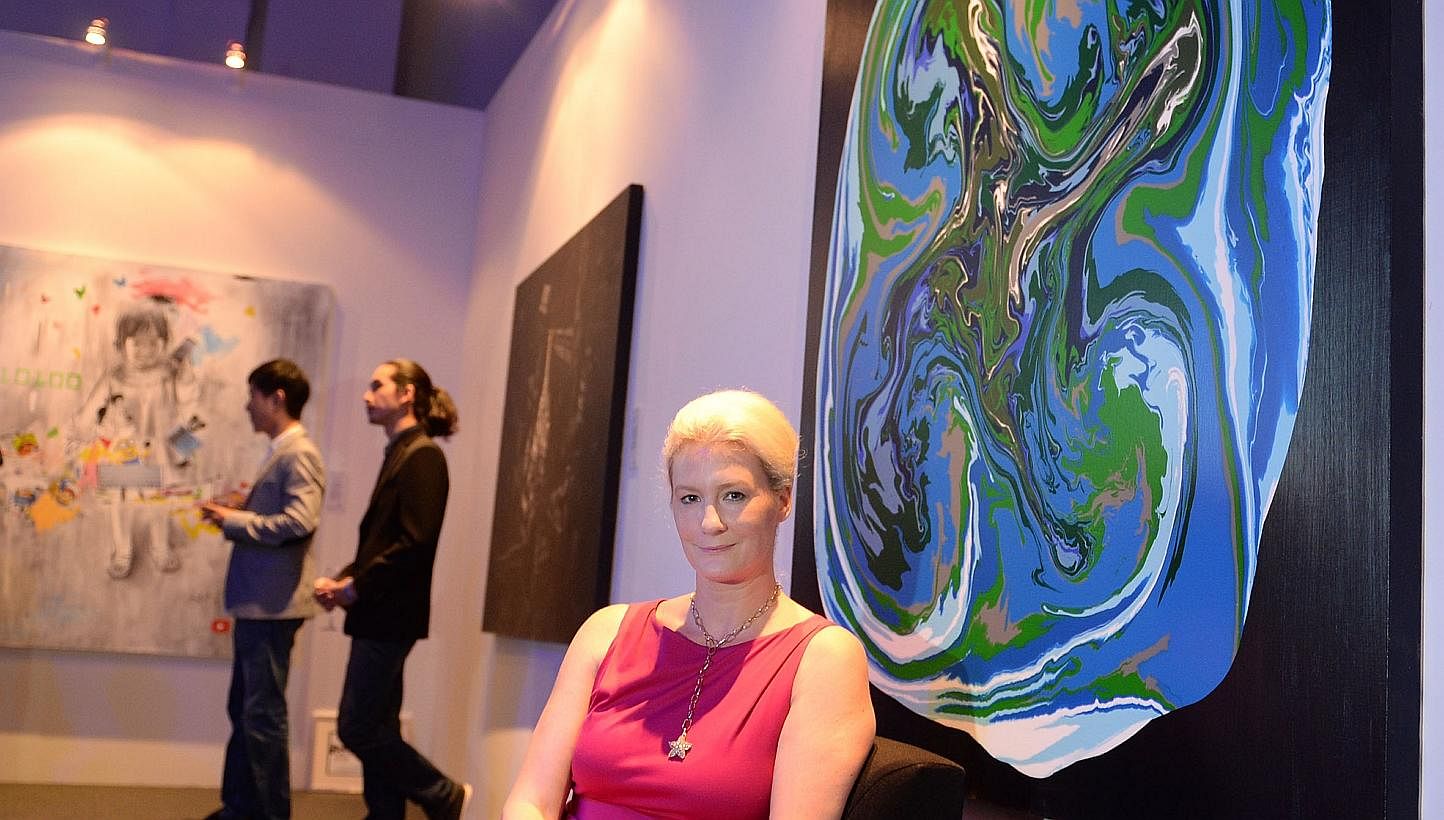 German- born, Singapore permanent resident Stefanie Hauger and her winning painting, Space Odyssey, which won both the newly introduced United Overseas Bank (UOB) South-east Asian Painting of the Year Award, and the UOB Painting of the Year Award (Si