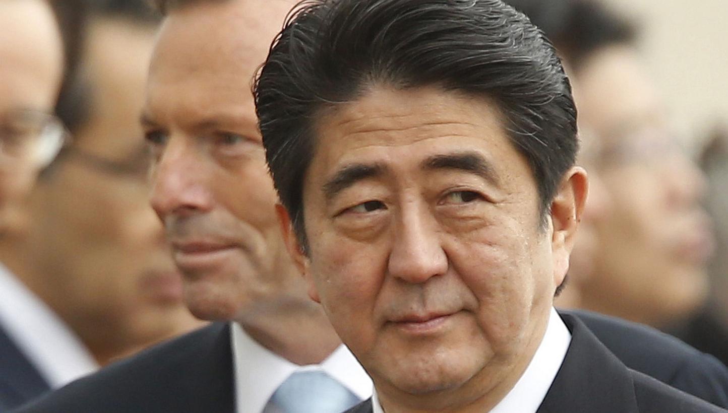 Japan's Prime Minister Shinzo Abe (right) participates in an official arrival ceremony with Australian Prime Minister Tony Abbott (back left) at Parliament House in Canberra on July 8, 2014. Japanese Prime Minister Shinzo Abe has been personally