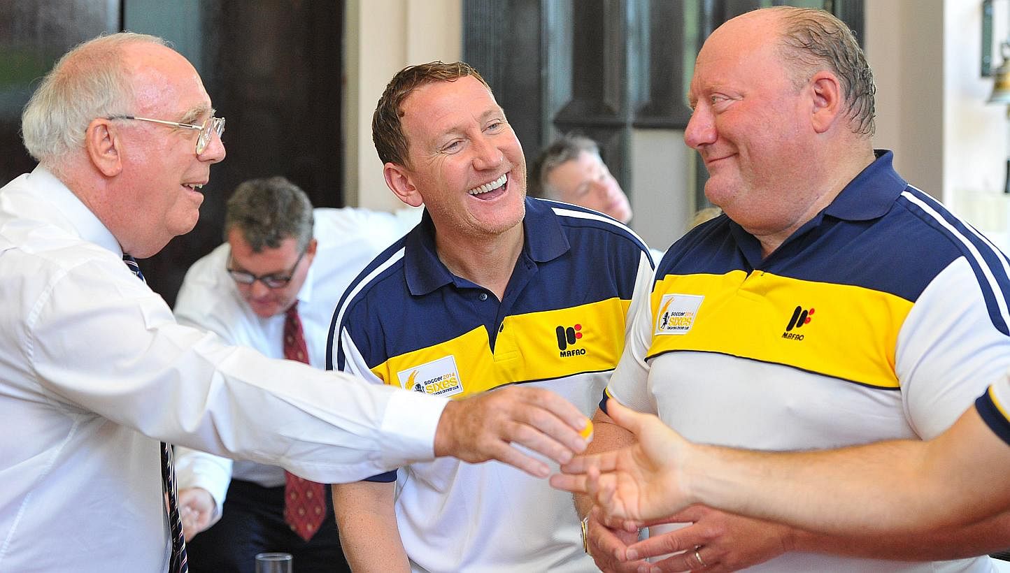 Mr Michael Grice, President of Singapore Cricket Club (left) chatting with football legends Mr Ray Parlour (centre) and Mr Alan Brazil at the tournament draw for the Singapore Cricket Club International Soccer Sixes at Singapore Cricket Club on May 1