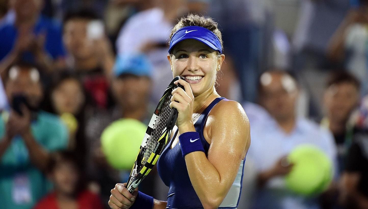 Canada's Eugenie Bouchard celebrates after winning her semi-final match against Caroline Wozniacki of Denmark at the Wuhan Open tennis tournament in Wuhan, in China's Hubei province on Sept 26, 2014. -- PHOTO: AFP