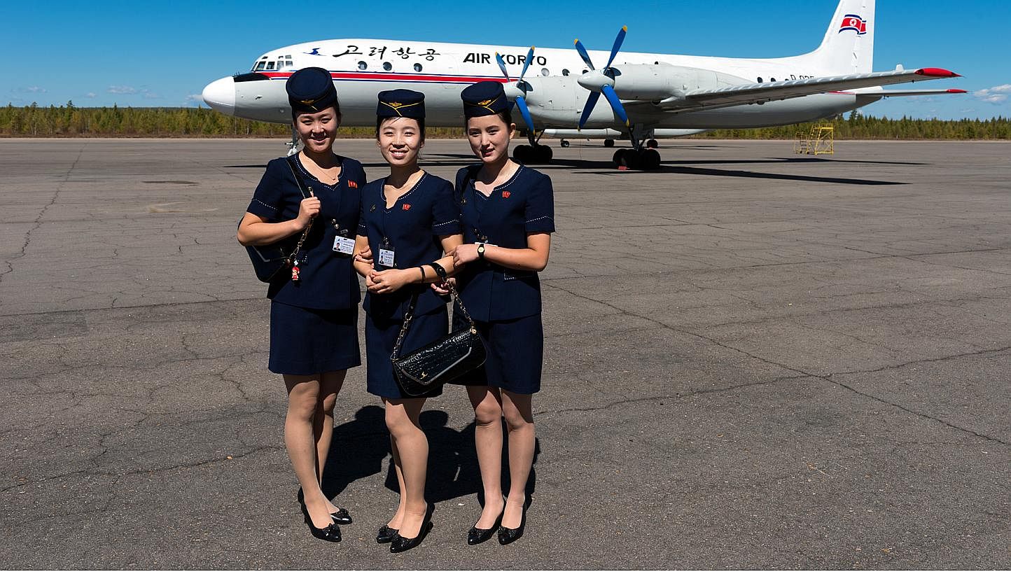 Greeted by smiling Air Koryo flight attendants dressed in smart navy blue outfits before he boarded an Ilyushin Il-18 plane, a large turboprop airliner. -- PHOTO: ARAM PAN(www.dprk360.com)