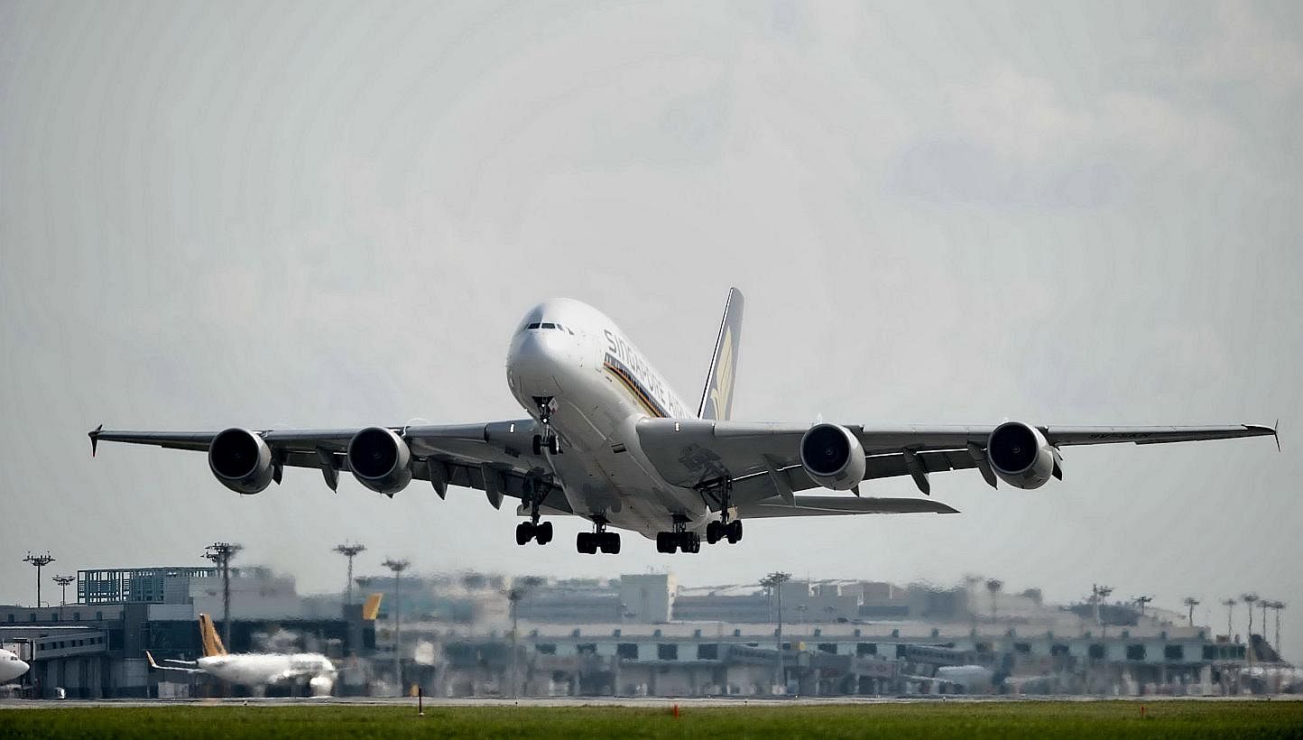 A Singapore Airlines A380 passenger plane taking off on a runway at Changi International Airport in Singapore. PHOTO: AFP