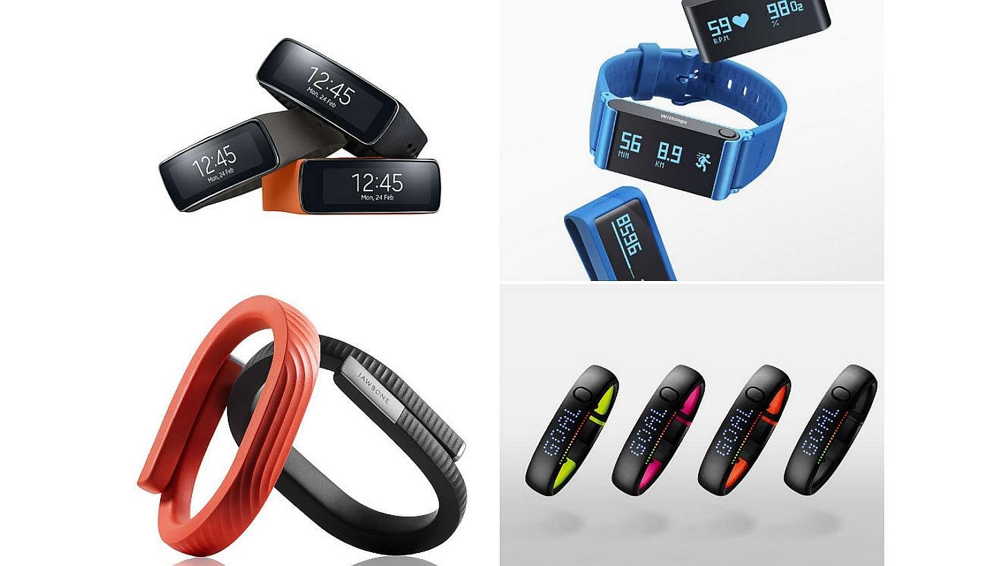 Gadgets that can help you keep fit and keep track of your calories: (clockwise, from top left) Samsung Gear Fit, Withings Pulse O2, Jawbone Up24 and Nike+ FuelBand SE. -- PHOTOS: SAMSUNG/WITHINGS/JAWBONE/NIKE INC