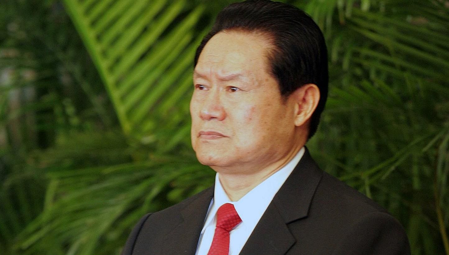Mr Zhou Yongkang, 72, faces a judicial probe for a slew of charges, including taking bribes, helping family members and cronies plunder government assets, and leaking official secrets, according to the official Xinhua news agency.&nbsp;-- PHOTO: CHIN
