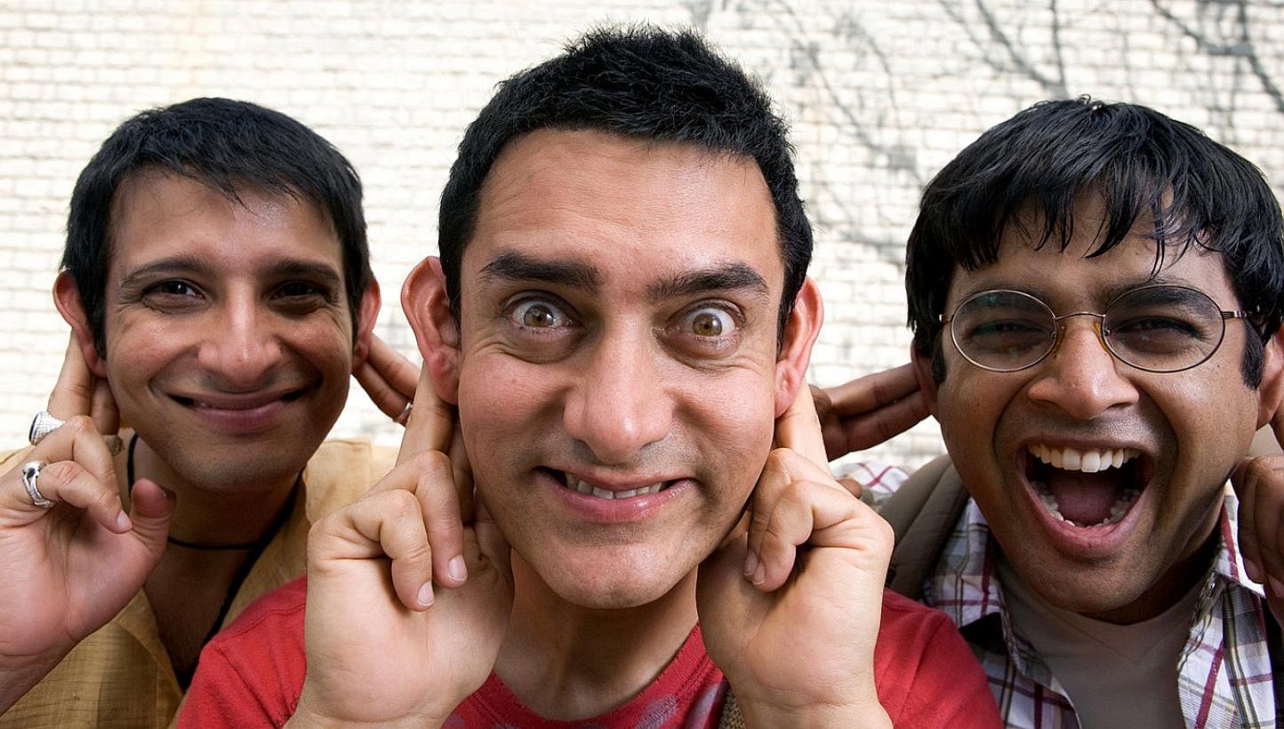 Aamir Khan in the controversial PK poster; in a scene from the film; with his second wife, film-maker Kiran Rao; and in 3 Idiots with Sharman Joshi (above left) and Madhavan (above right). -- PHOTO: JALAN DISTRIBUTORS