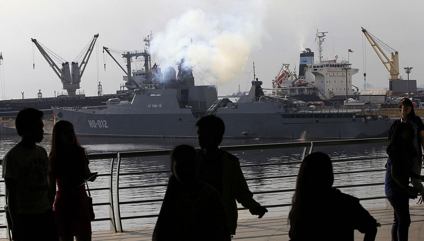 People viewing one of two of Vietnam's Russian-built missile-guided frigates docked at a bay in Manila on &nbsp;Nov 25, 2014. &nbsp;Vietnam's two most powerful warships were making their first port call to the Philippines but an official said it was 