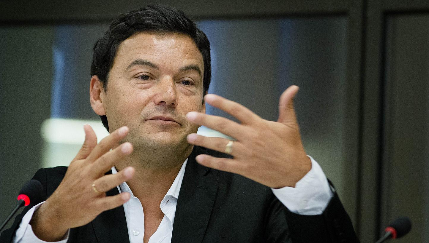 France's influential economist Thomas Piketty (above), author of Capital In The 21st Century, on Thursday refused to accept the country's highest award, the Legion d'honneur, to criticise the Socialist government in power. -- PHOTO: AFP