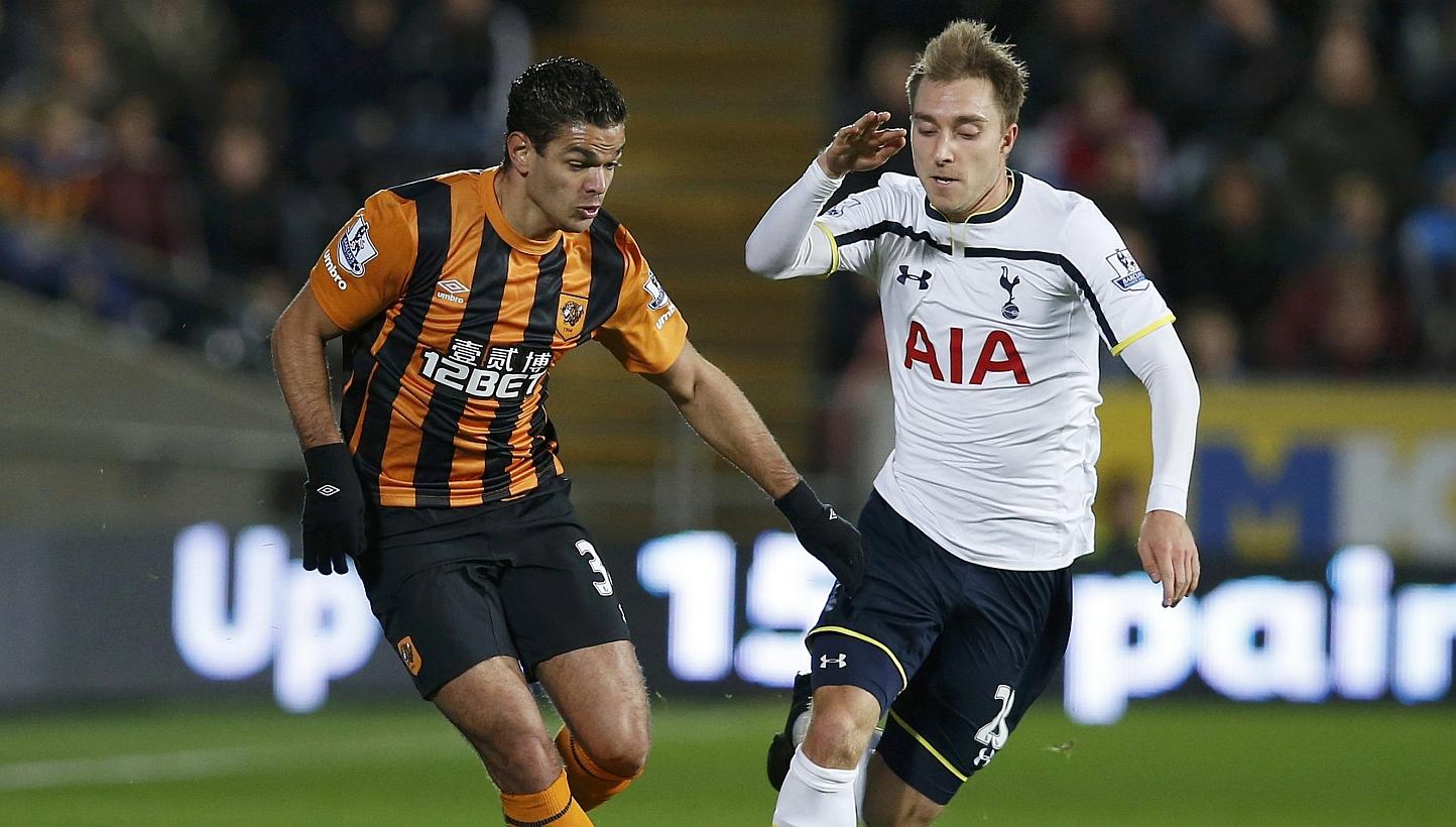 Hull City's Hatem Ben Arfa (left) challenges Tottenham Hotspur's Christian Eriksen during their English Premier League football match at the KC Stadium in Hull, northern England Nov 23, 2014. -- PHOTO: REUTERS