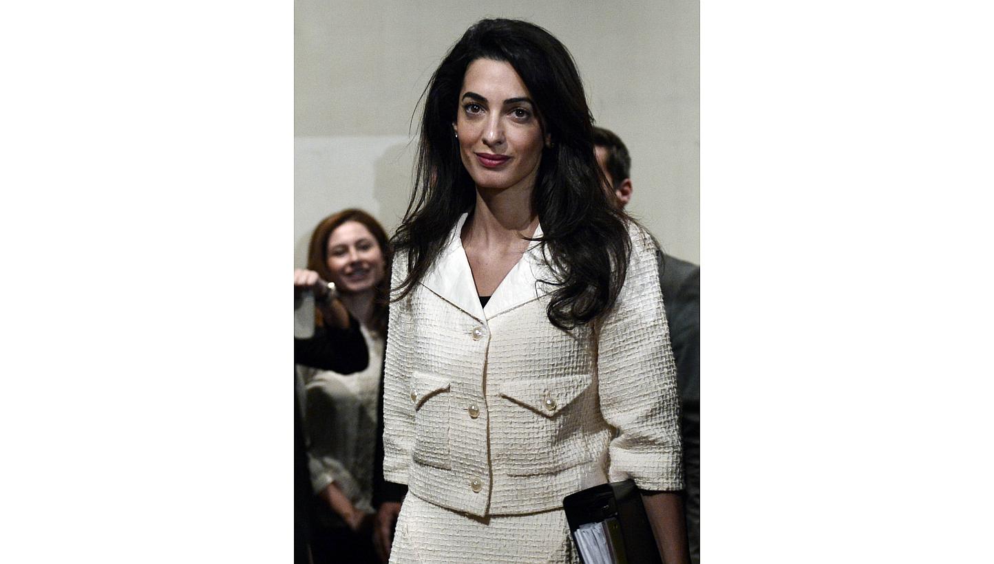 Human-rights lawyer Amal Clooney at a press conference at the Acropolis museum in Athens on Oct 15, 2014. Clooney claimed in an interview published on Saturday that she was threatened with arrest in Egypt after identifying flaws in the judicial syste