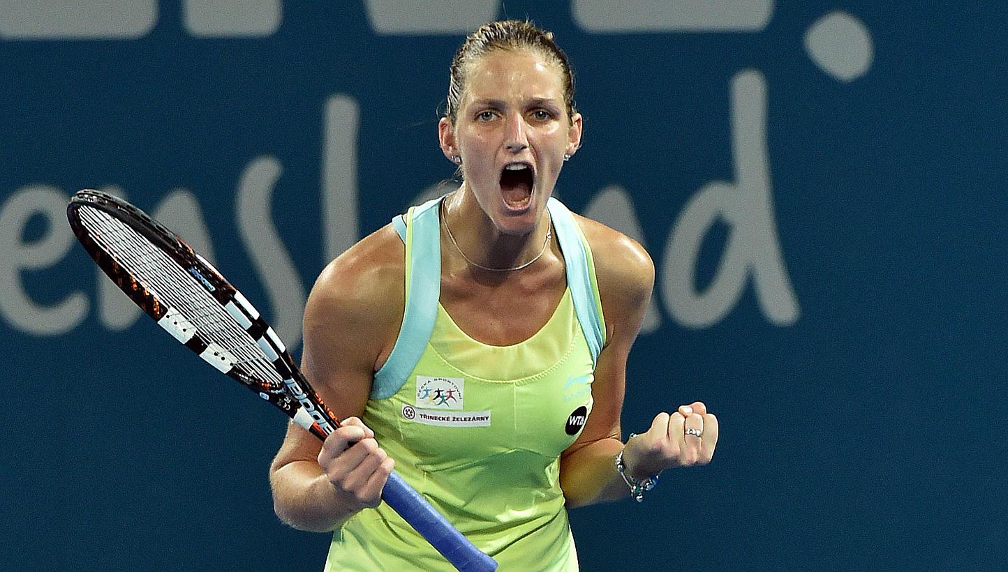 Karolina Pliskova of the Czech Republic celebrates her victory over Victoria Azarenka of Belarus in the women's singles match on day two of the Brisbane International tennis tournament on Jan 5, 2015, spoiling the latter's&nbsp;comeback bid after an 