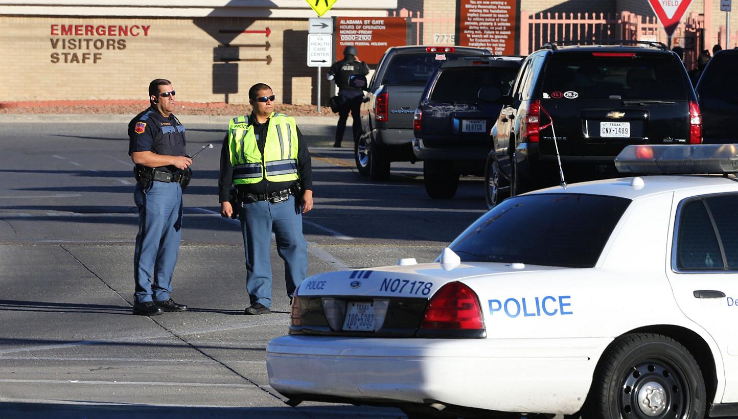 El Paso police blocking off an entrance to the Beaumont Army Medical Center as other officers search for the gunman during the shooting in El Paso, Texas, on Jan 6, 2015. -- PHOTO: REUTERS