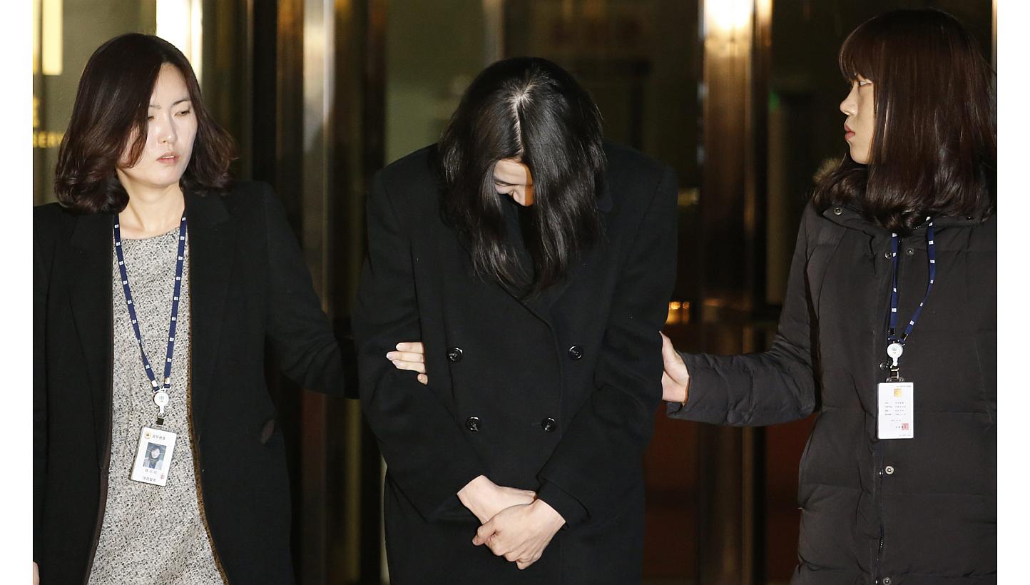 Cho Hyun Ah (centre), also known as Heather Cho, daughter of Korean Airlines chairman Cho Yang Ho, leaves for a detention facility after a Korean court ordered her to be detained, at the Seoul Western District Prosecutor’s office on Dec 30, 2014.&n