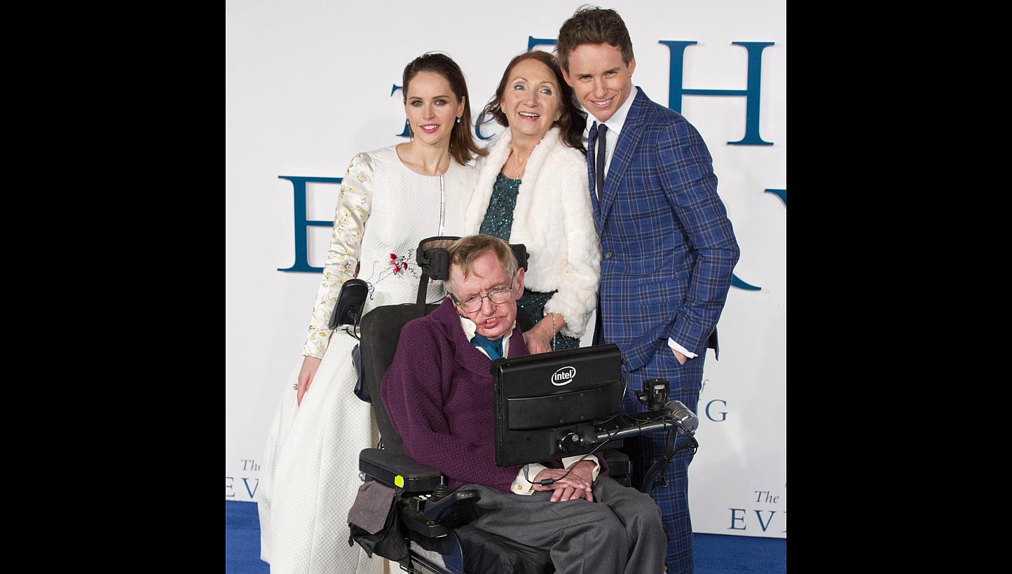 British scientist Stephen Hawking (front) at the UK premiere of The Theory Of Everything with (back row from left) actress Felicity Jones, his ex-wife Jane Wilde and the actor who plays him, Eddie Redmayne. -- PHOTO: AGENCE FRANCE-PRESSE