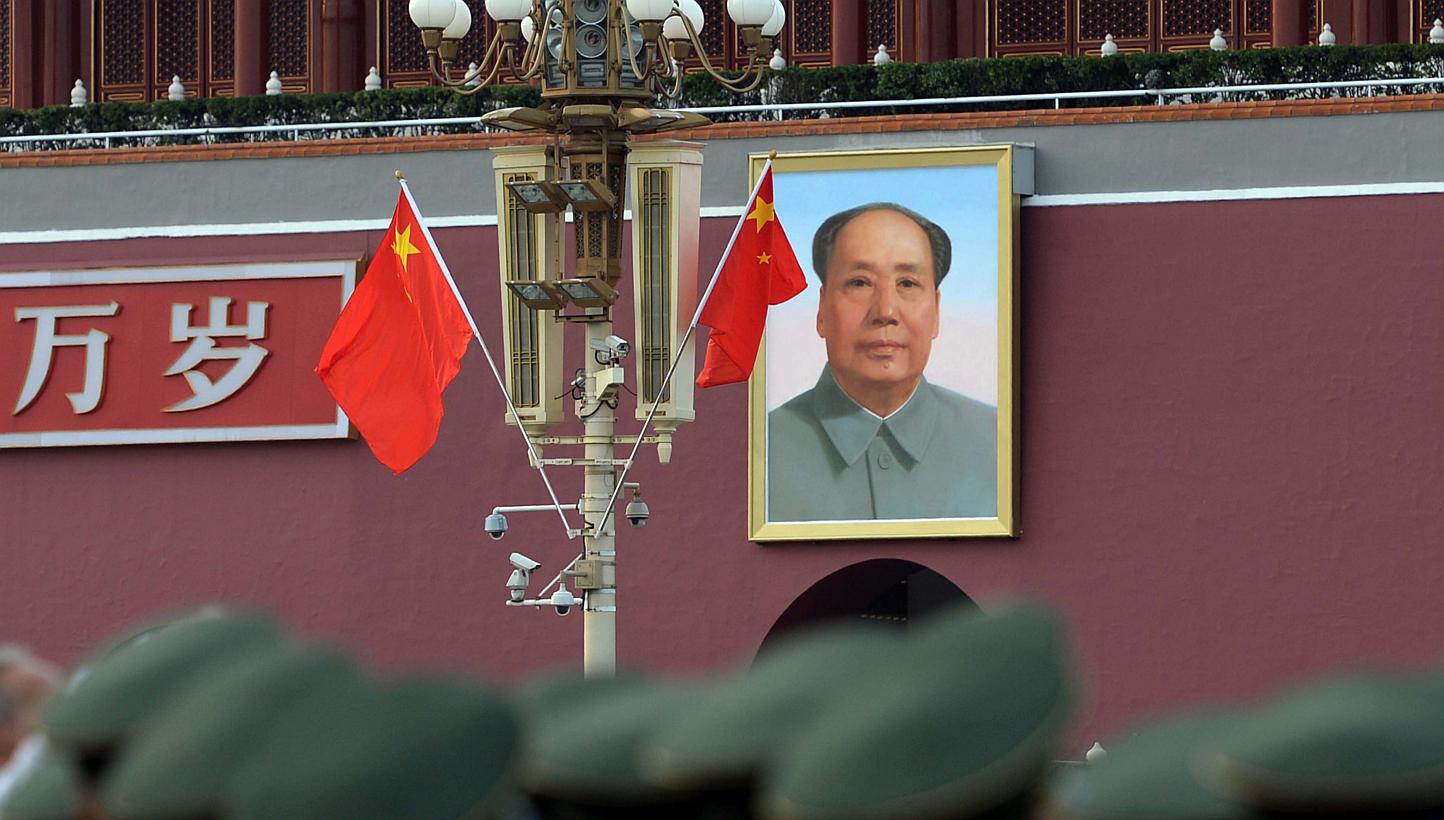This picture taken on Sept 27, 2014 shows soldiers standing before freshly decorated Tiananmen Gate a few days before the 65th anniversary of People's Republic of China in Beijing. -- PHOTO: AFP