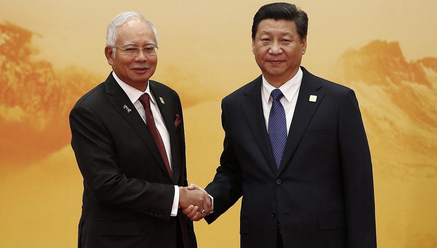 Malaysian Prime Minister Najib Razak with Chinese President Xi Jinping. Malaysia has maintained friendly relations with China, and as Asean chairman could facilitate progress in talks over disputes in the South China Sea. -- PHOTO: REUTERS