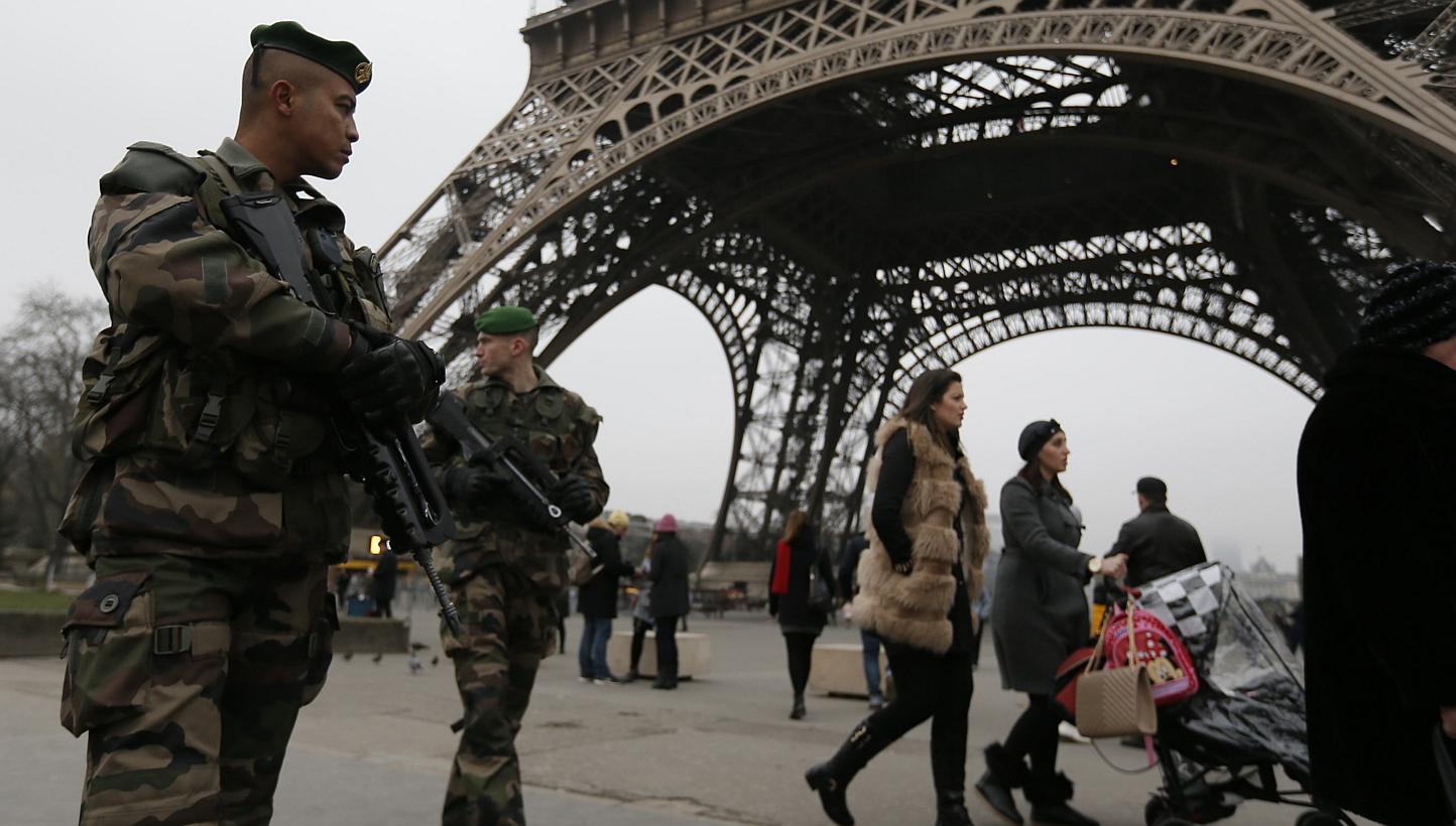 French soldiers on patrol near the Eiffel Tower in Paris, after a shooting at the Paris offices of Charlie Hebdo Jan 7, 2015. Troops in railway stations, armed police outside media buildings, ultra-tight security at department stores: Paris beca