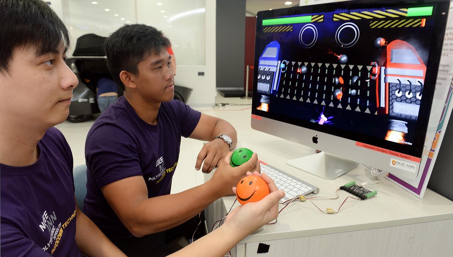 (From left) Lliow Teck Meng, 26, and Raynard Hadiwidjaja, 20, are among a team of students from Ngee Ann Polytechnic Information Technology and Multimedia Animation courses who have developed a stress ball physiotherapy system that integrates convent
