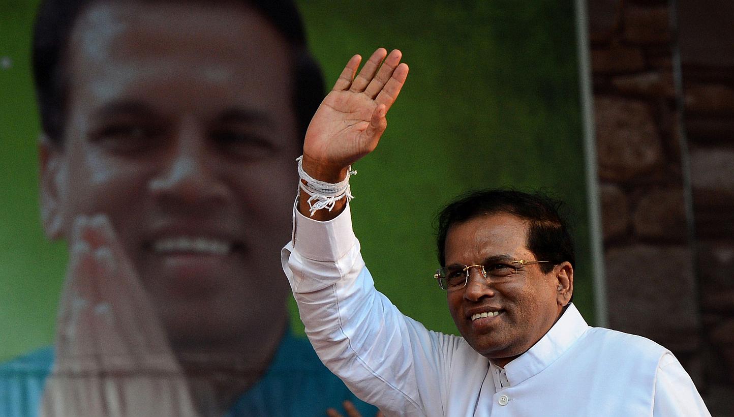 Sri Lanka’s main opposition candidate Maithri Sirisena (above) has taken an early lead over incumbent Mahinda Rajapakse in the island’s bitterly contested presidential election. --PHOTO: AFP