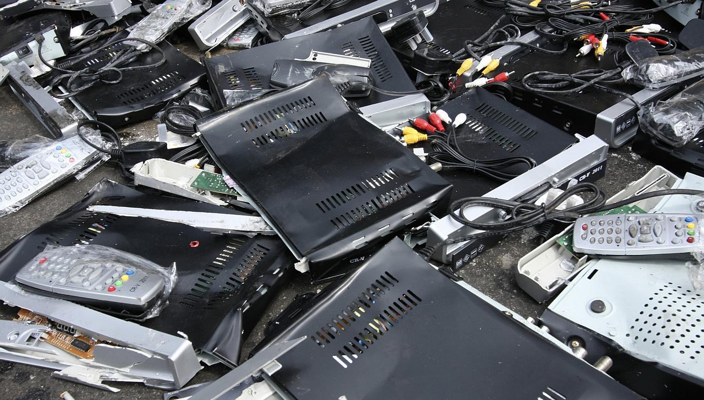 Illegal cable TV set-top boxes that have been crushed. -- PHOTO: STARHUB
