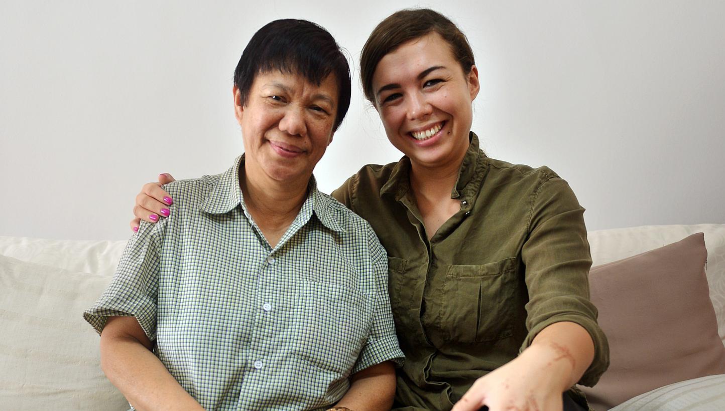 Ms Colleen Turzynski with Madam Chan Yoke Mei, her late mum's best friend. Madam Chan showed her sepia-toned photos of her mother with friends. "She knows more about my mum than I do," said Ms Turzynski.