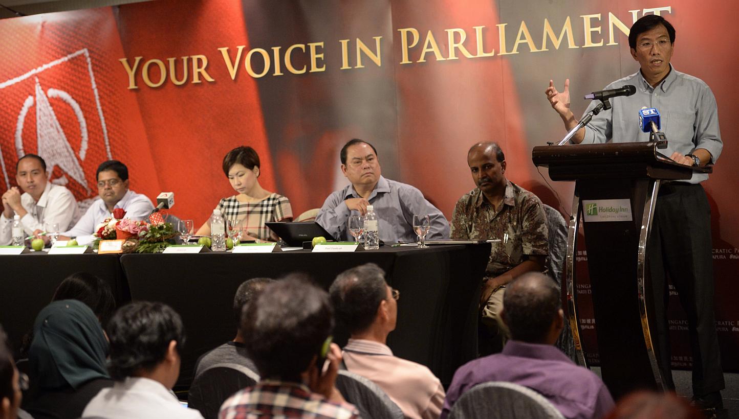 Singapore Democratic Party (SDP) secretary-general Chee Soon Juan (right) speaks during the SDP GE2015 Campaign Kick-off while party member Bryan Lim (from left), party member James Gomez, assistant treasurer Jaslyn Go, vice chairman John Tan and par