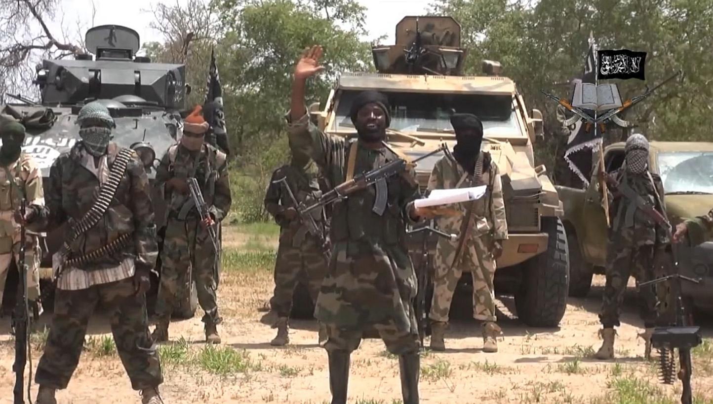 A screengrab taken on July 13, 2014 from a video released by the Nigerian Islamist extremist group Boko Haram and obtained by AFP shows the leader of the Nigerian Islamist extremist group Boko Haram, Abubakar Shekau (centre). -- PHOTO: AFP
