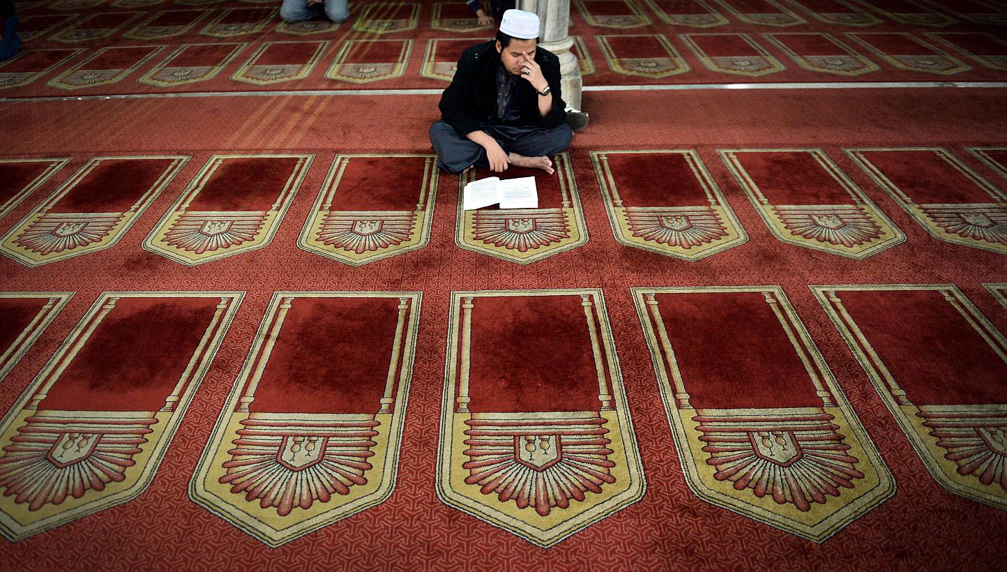 An Egyptian reading from the Quran in a Cairo mosque. "In Islam," says scholar Maulana Wahiduddin Khan, "blasphemy is a subject of intellectual discussion rather than a subject of physical punishment."