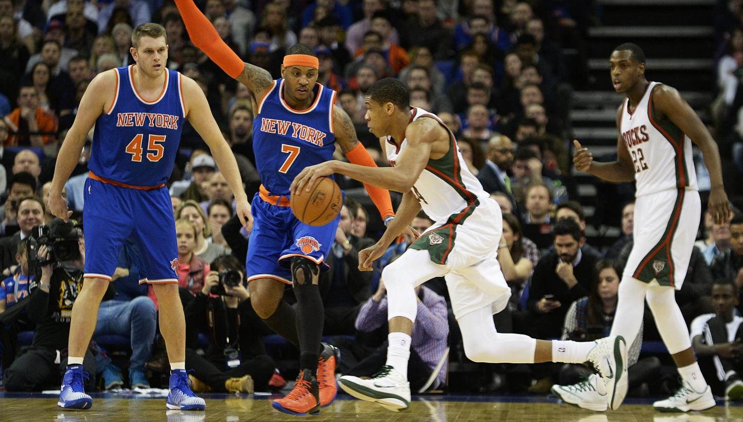 Giannis Antetokounmpo from Milwaukee Bucks (2nd from right) competes for the ball against Carmelo Anthony of the New York Knicks (2nd from left) during an NBA game at the O2 Arena in London, Britain on Jan 15, 2015. -- PHOTO: EPA