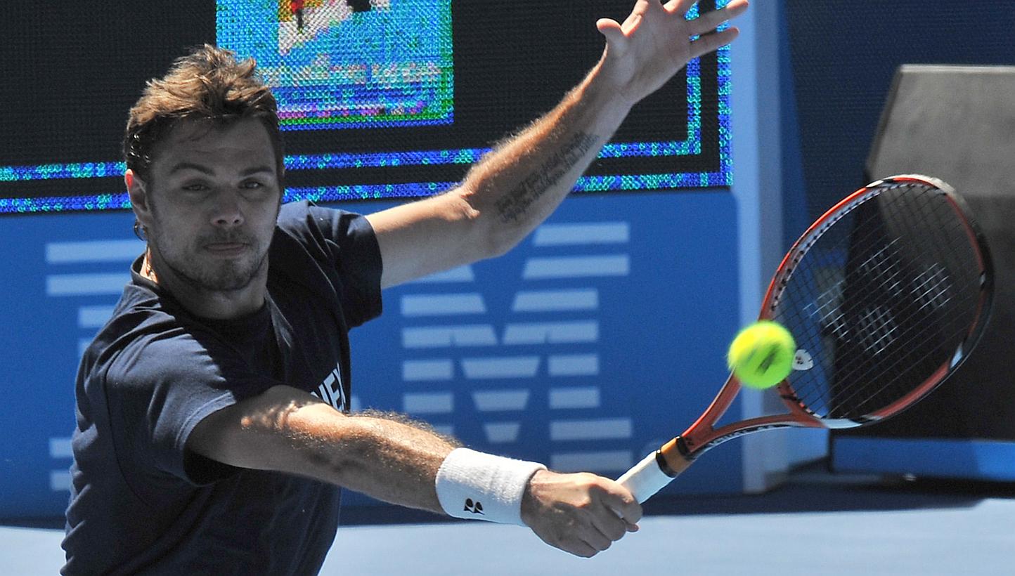 Stan Wawrinka of Switzerland hits a return during a training session ahead of the Australian Open tennis tournament in Melbourne on Jan 16, 2015. The defending champion was on Friday pitted in the top half of the draw at the Australian Open with Nova