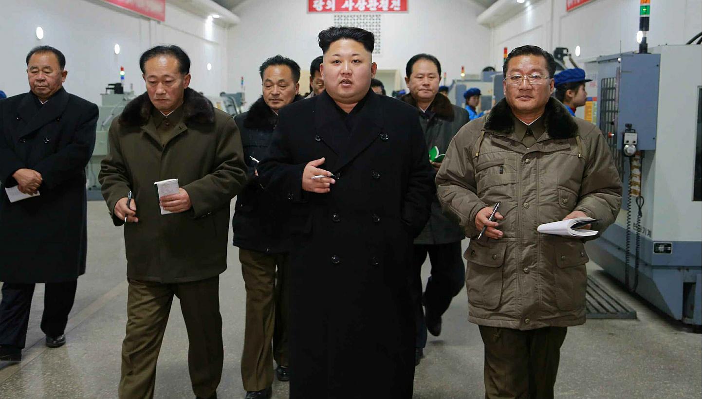 An undated picture released by the North Korean Central News Agency (KCNA) on Jan 16, 2015, shows North Korean leader Kim Jong Un (centre) touring a precision machine factory in Pyongyang, North Korea. North Korea said on Friday it was committed to f
