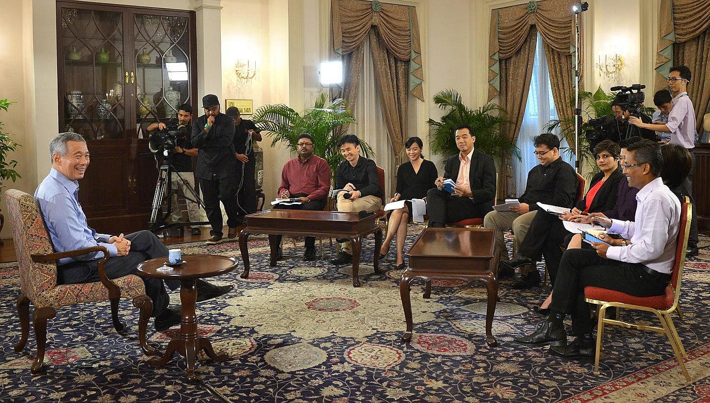 Prime Minister Lee Hsien Loong (left) during an interview with Singapore media at the Istana on Jan 14, 2015. -- ST PHOTO: ALPHONSUS CHERN