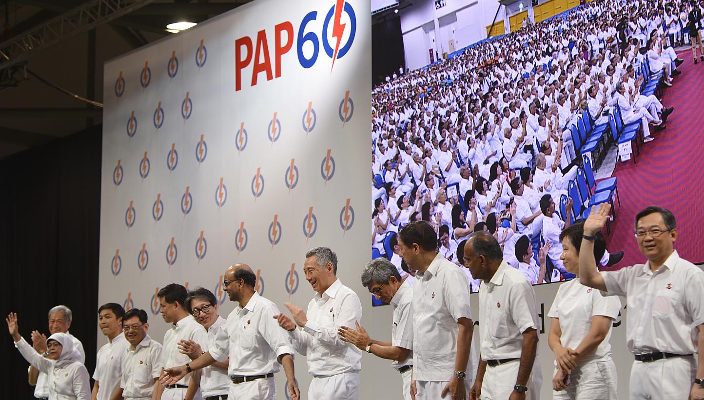 Prime Minister Lee Hsien Loong, who is also the People's Action Party’s secretary-general, with other members of the PAP’s new central executive committee at the PAP60 Rally on Dec 7, 2014. -- ST PHOTO: MARK CHEONG