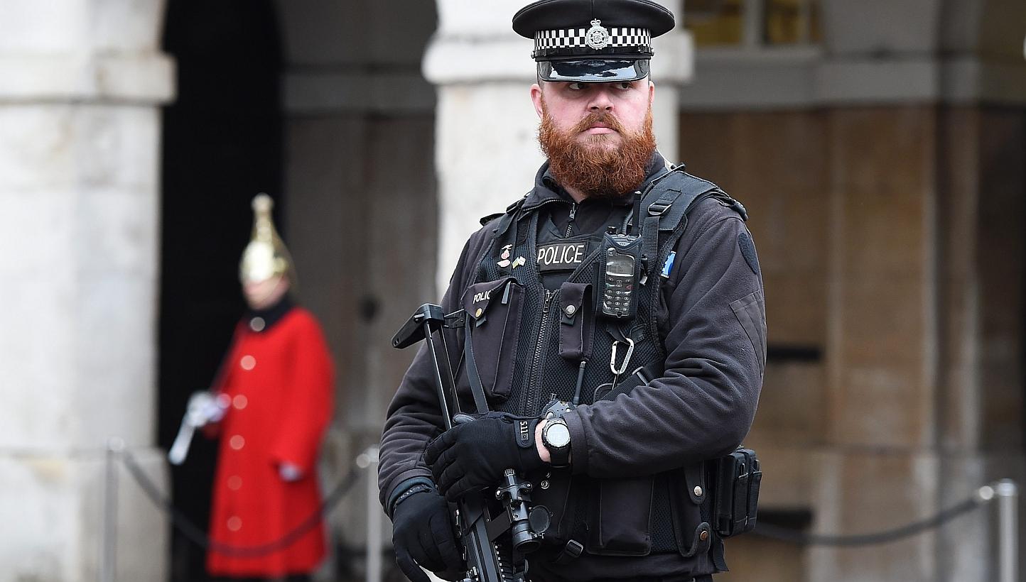 An armed policeman standing guard at Downing Street in London, Britain, on Jan 12, 2015. Britain's ability to prevent terrorist attacks is hampered by outdated laws that are "no longer fit for purpose", a former MI5 chief said in an interview pu