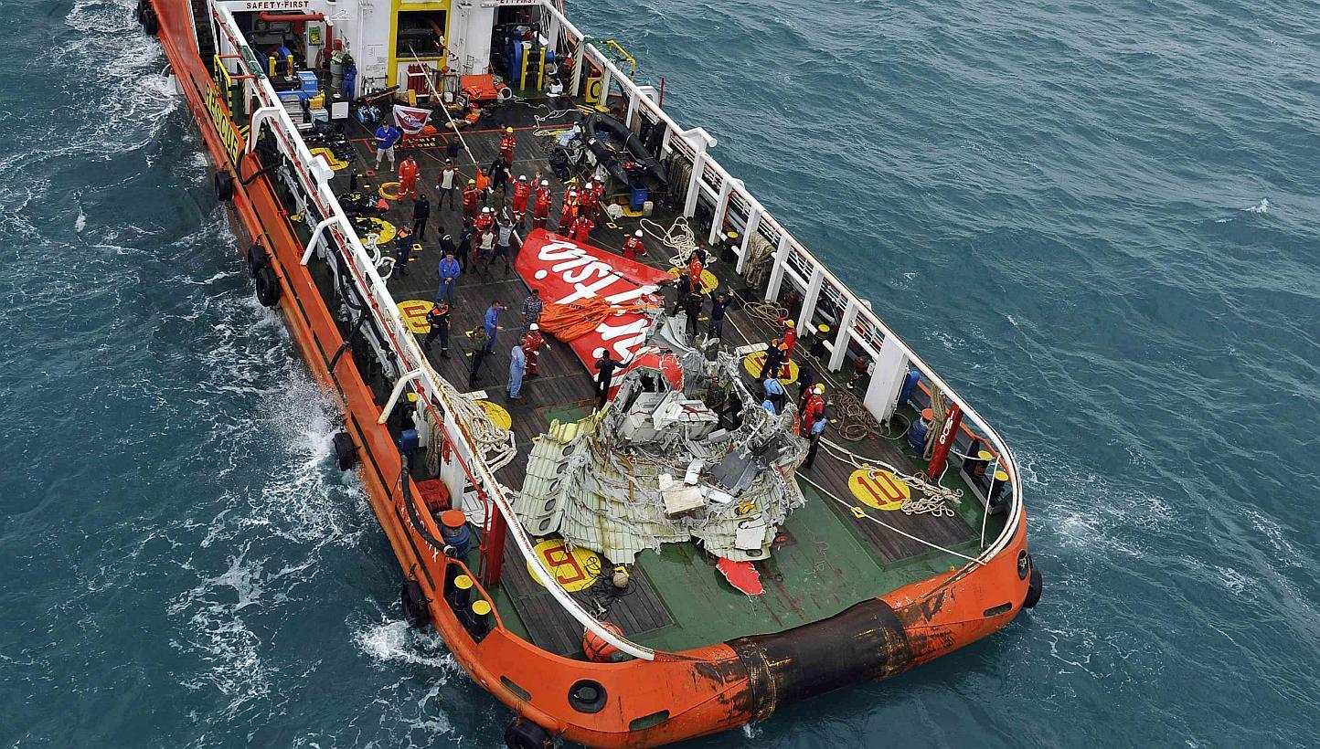 The tail of AirAsia QZ8501 passenger plane is seen on the deck of the Indonesian Search and Rescue (Basarnas) ship Crest Onyx after it was lifted from the sea bed, south of Pangkalan Bun, Central Kalimantan on Jan 10, 2015. -- PHOTO: REUTERS
