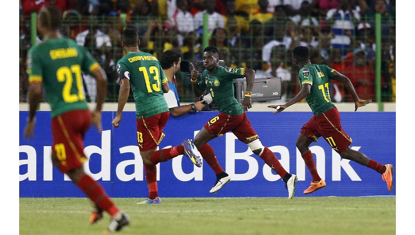 Cameroon's Ambroise Oyongo (second from right) celebrating his goal against Mali during their 2015 African Cup of Nations Group D football match in Malabo on Jan 20, 2015. -- PHOTO: REUTERS