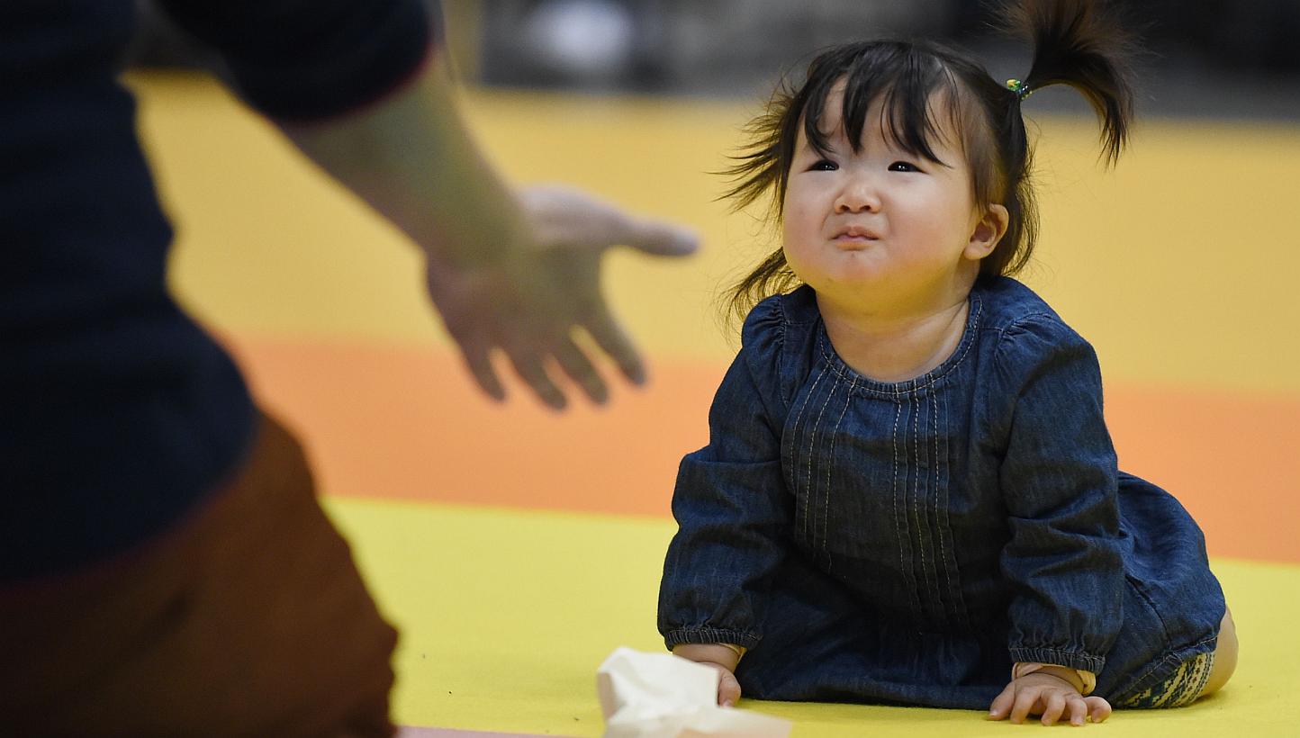 Fertility rates in Japan bottomed out at 1.26 children per woman in 2005, and have been rising since - despite the sharp recession and natural disasters that happened in the meantime. -- PHOTO: AFP
