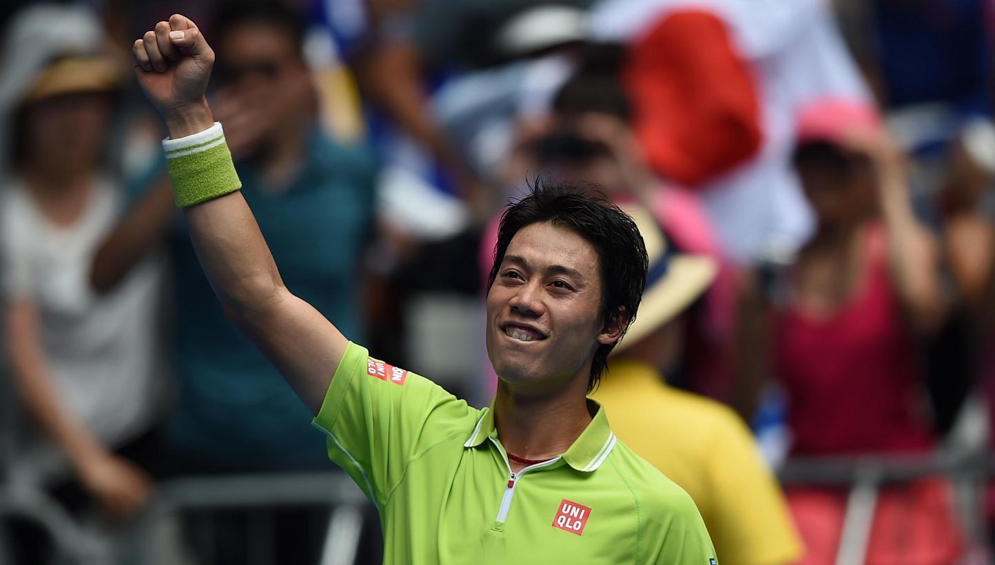 Kei Nishikori of Japan celebrating his victory over Ivan Dodig of Croatia in their men's singles match on day four of the Australian Open in Melbourne on Jan 22, 2015. -- PHOTO: AFP&nbsp;