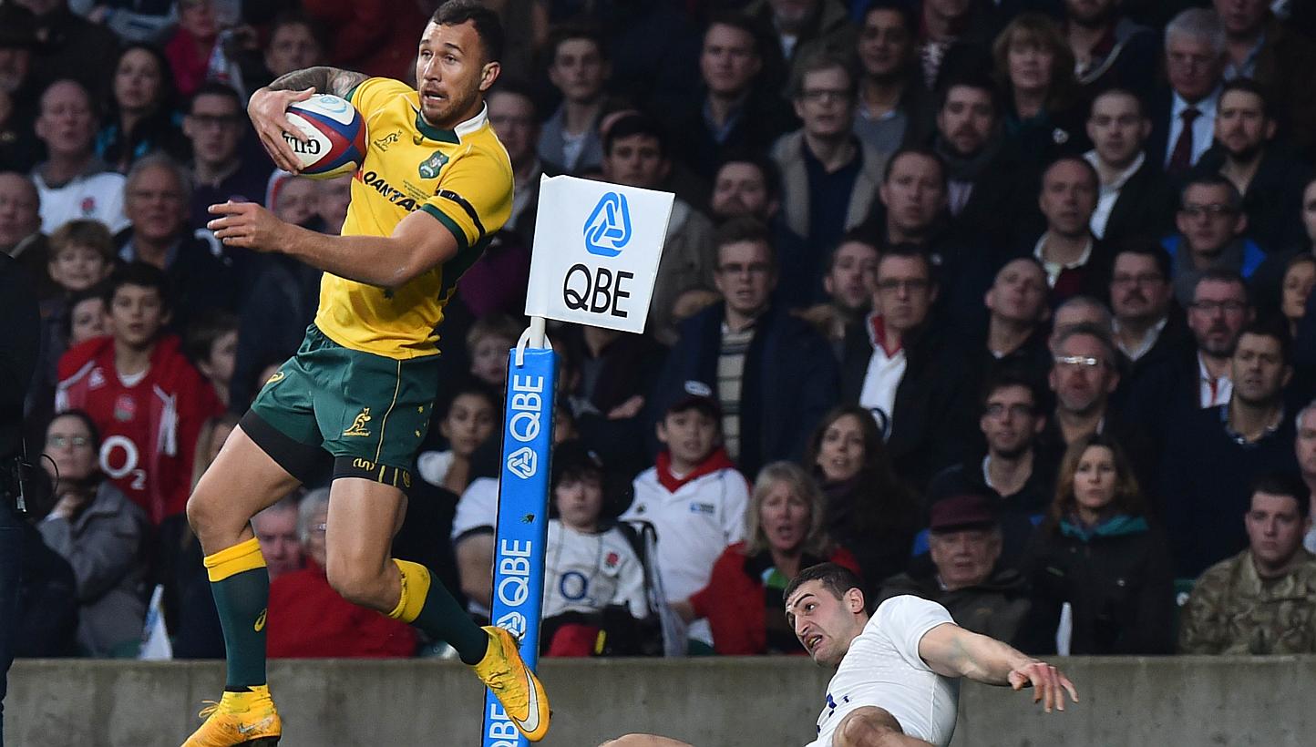 Australia's Quade Cooper (left) wins the ball from England's wing Jonny May (right) during the Autumn International rugby union Test match between England and Australia at Twickenham Stadium, southwest of London on Nov 29, 2014. Wallaby fly-half Quad